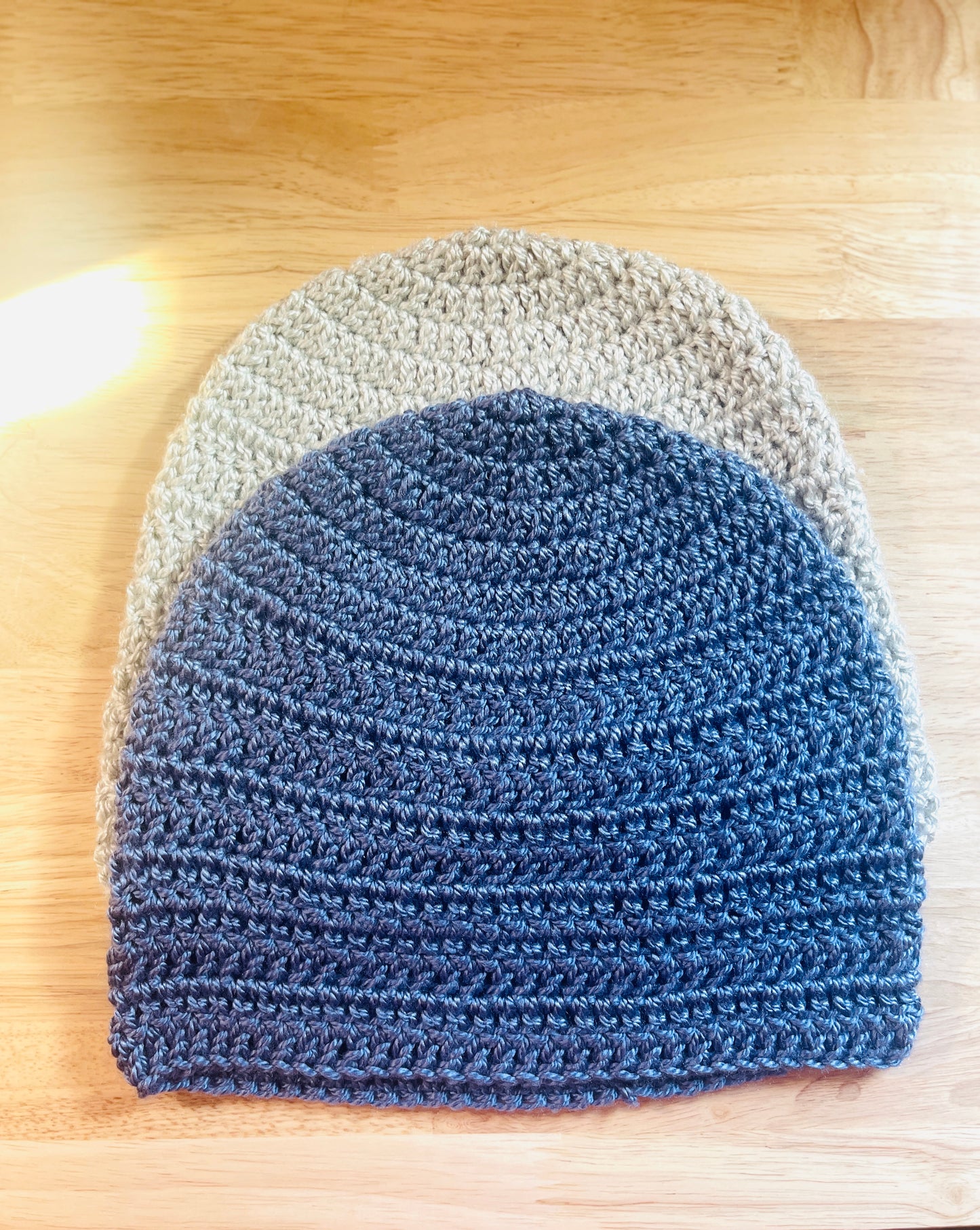 This handmade crochet beanie answers with soft, reliable warmth and a no-fuss design that works with everything in your closet. Colors: blue and light gray, circumference 22" 9" long , 100% premium yarn, Machine washable and tumble dry.