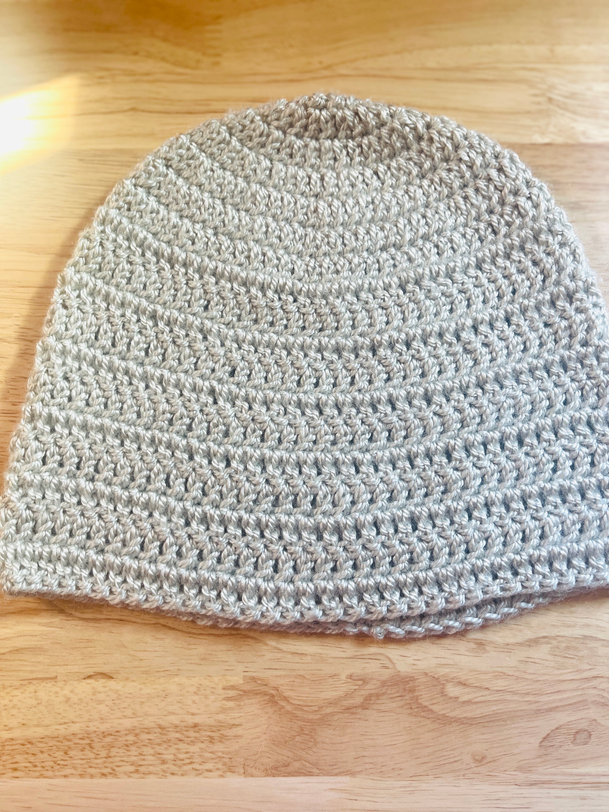 This handmade crochet beanie answers with soft, reliable warmth and a no-fuss design that works with everything in your closet. Colors: blue and light gray, circumference 22" 9" long , 100% premium yarn, Machine washable and tumble dry.