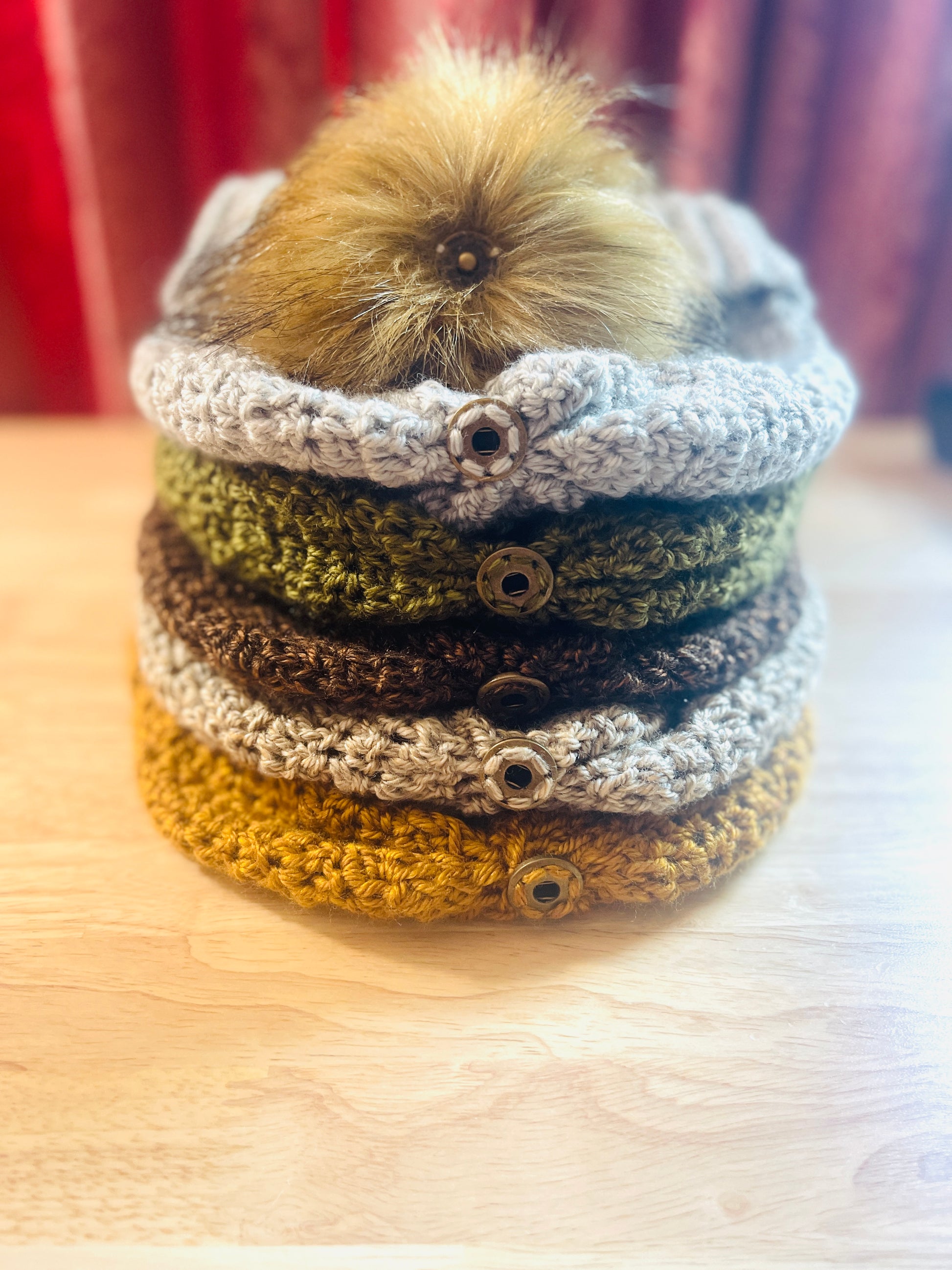 Showing top of  women beanie with detachable pom pom